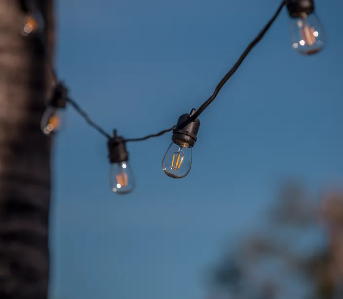 Unique Lighting Systems - Bistro Lights Outdoor Living Series